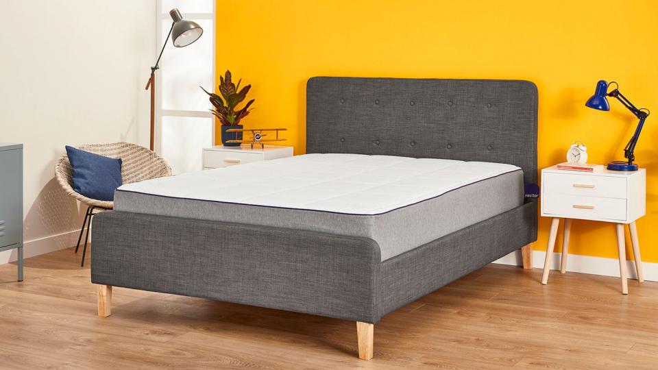 Nectar memory foam mattress on an upholstered bed frame in a bedroom