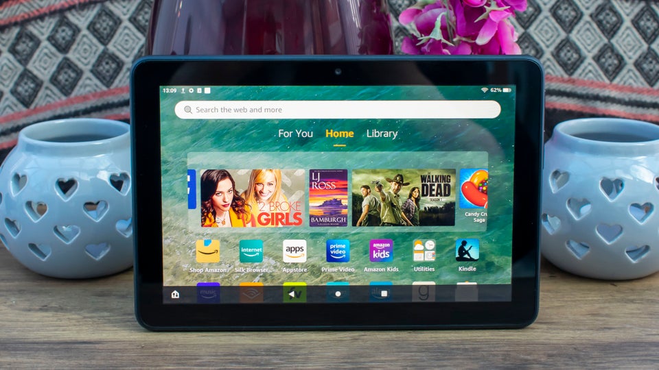 Best Android tablet - Amazon Fire HD 8 on a table with candles and flower