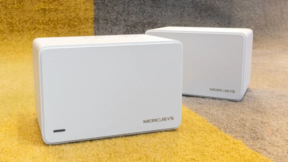 Mercusys Halo H80X two node mesh Wi-Fi system on a yellow and grey rug