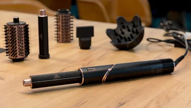shark flexstyle hair dryer on wooden table with parts - dyson airwrap vs shark flexstyle