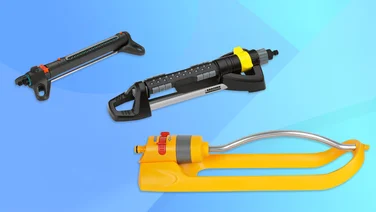 Three garden sprinklers on a blue background