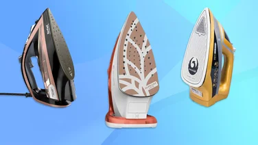 A selection of three steam irons set against a blue background