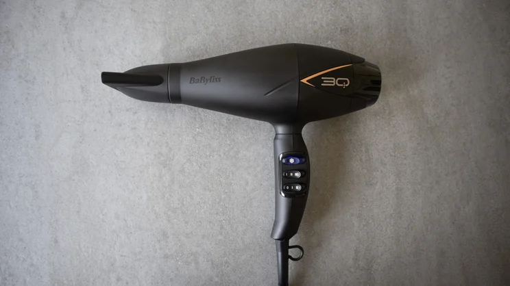 Babyliss 3q hair dryer photographed on a grey slate surface