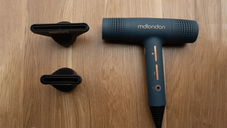 Mdlondon blow photographed on a wooden surface with two concentrator nozzle attachments