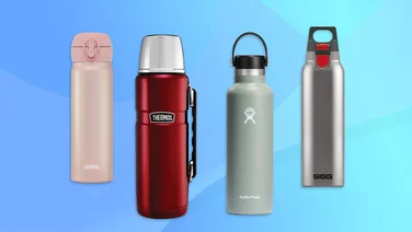 Four insulated drinks flasks on a blue background