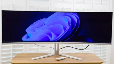 phillips evnia oled monitor on a white background desk