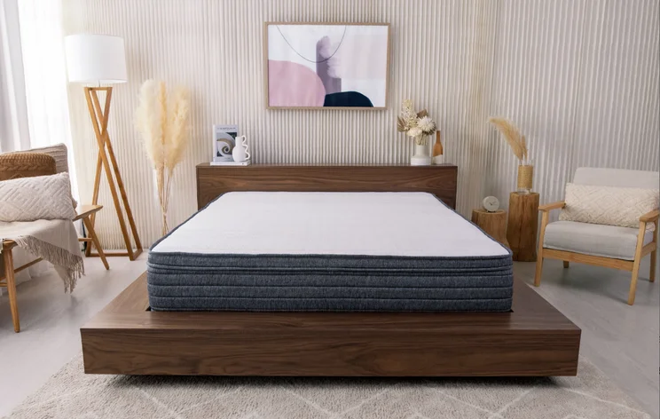 Bed with Origin Hybrid Mattress in decorated room