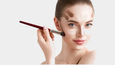Best liquid highlighter header woman applying make up to her face
