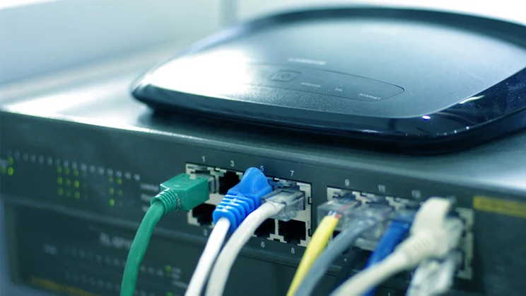 wifi router with wires beneath how to access and change your router settings
