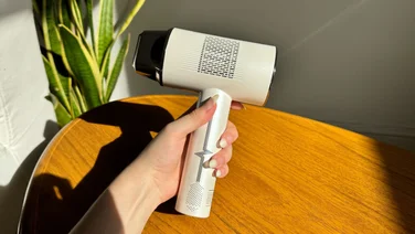 an image of the best IPL and laser hair removal machine being held during our product review testing