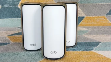 Netgear Orbi 970 - front header on a colourful rug
