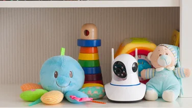 baby monitor on shelf with colourful toy - where to mount baby monitor