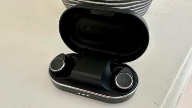 Cambridge Audio Melomania M100 review - featured image of the wireless earbuds in their charging case