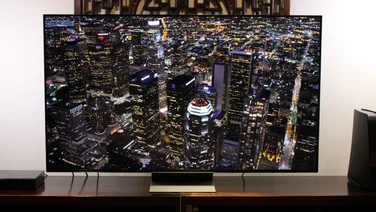 LG QNED91 review-Image of the TV from a front on view displaying a city skyline at night