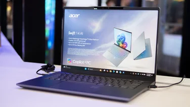The Acer Swift 14 AI pictured on a stand at the Computex trade show, 2024