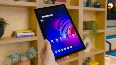 acer iconia tab p11 review tablet in hand with home screen on and shelf in background