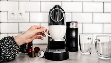 how long does a coffee machine last header coffee machine in front of white tiles