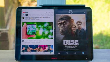 OnePlus Pad 2 in front of a window, showing the split-screen function on its display
