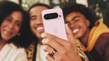 Three people taking a selfie together with the Google Pixel 9 Pro