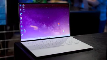 Dell XPS 13 with Intel Core Ultra 200V series _16 on a black plinth in a dark room