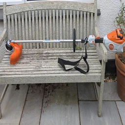Stihl FSA 80R cordless strimmer on a garden bench