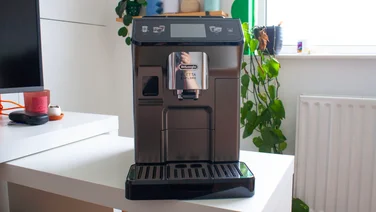 Delonghi Eletta Explore coffee machine sat on desk