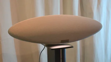 Image of the Bowers & Wilkins Zeppelin Pro Edition on a stand in front of a white curtain