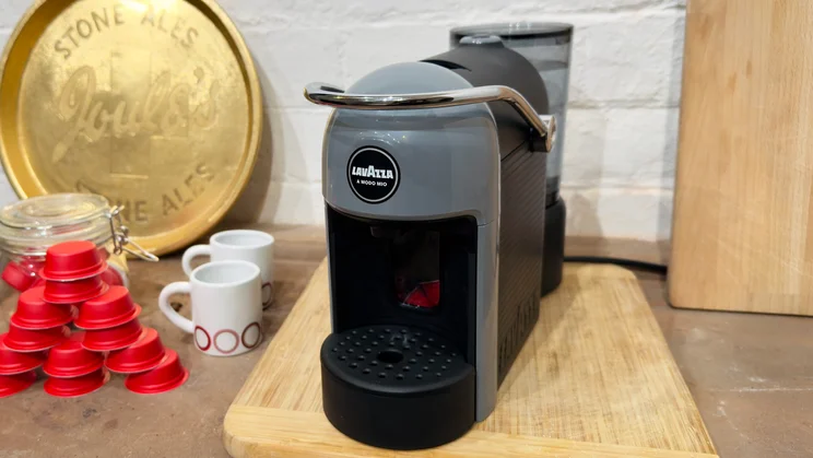 Lavazza Jolie Evo review header coffee machine sitting on a wooden chopping board