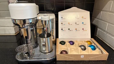 Nespresso Vertuo Creatista teaser coffee machine on a black worktop