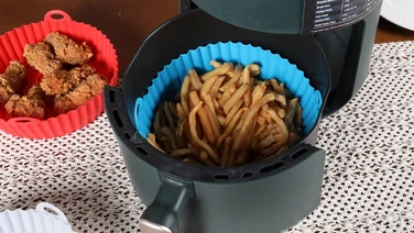 best air fryer accessories hteaser silicon baskets one red and the orther blue