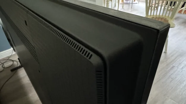 Close-up image of the back right corner of the TCL Q9BK 4K TV