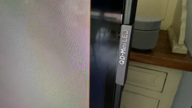 Close-up image of the QD Mini LED logo on the side of the TCL Q9BK's panel