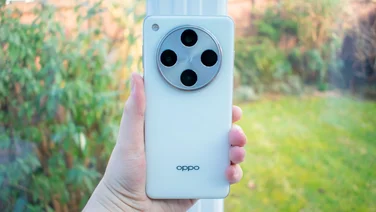 Oppo Find X8 Pro in hand, rear view, in front of a window
