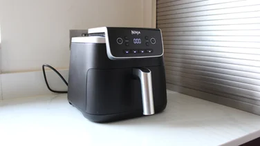 Ninja Air Fryer Pro 4.7l in a corner on a white worktop