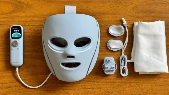 Shark Cryoglow Review-1 full mask and contents of the box on a wooden table