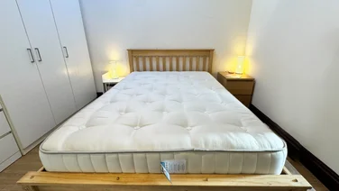 Simba Earth Source mattress review full view of mattress on a pine frame