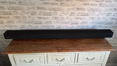 sony_bravia_theatre_bar_9_review_featured_image front view of soundbar on a wooden sideboard