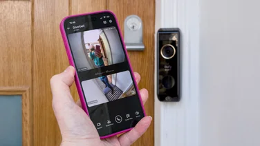 An Expert Reviews writer testing a video doorbell with their phone