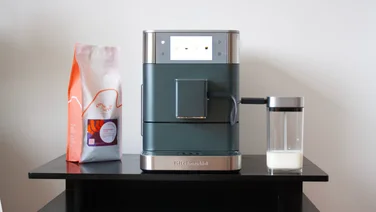 KitchenAid KF8 coffee machine review LEAD IMAGE coffee machine, with milk jug and coffee bean bag