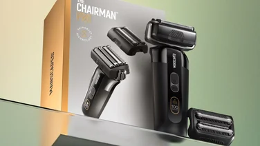 ManscapedPack showing the box on a glass shelf with the razor and attachment in front of it