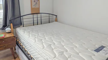 Premier Inn 2.0 Mattress review full view of the mattress on a black metal bed frame