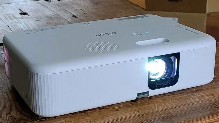 The Epson CO-FH02 projector on a wooden table