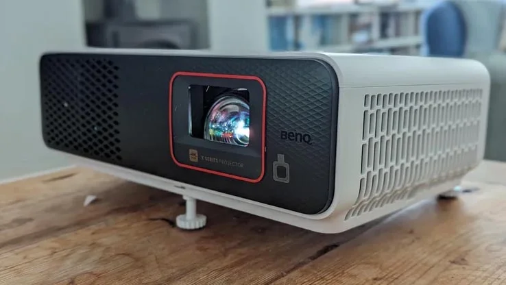 The BenQ X500i projector on a wooden table