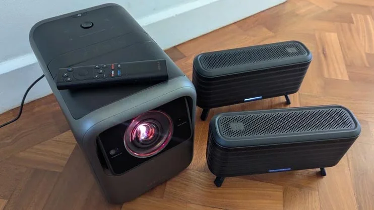 The Nebula X1 projector with its two optional satellite speakers