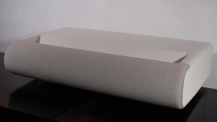 The Samsung Premiere 9 ultra-short throw projector on a black table