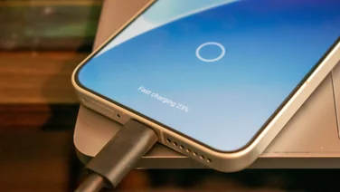 Fastest charging phones - a phone plugged in showing on the display that it is fast charging