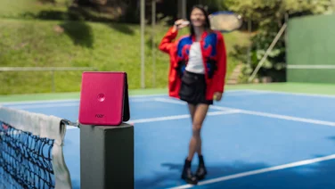 Motorola Razr 60 Ultra folded on a tennis court