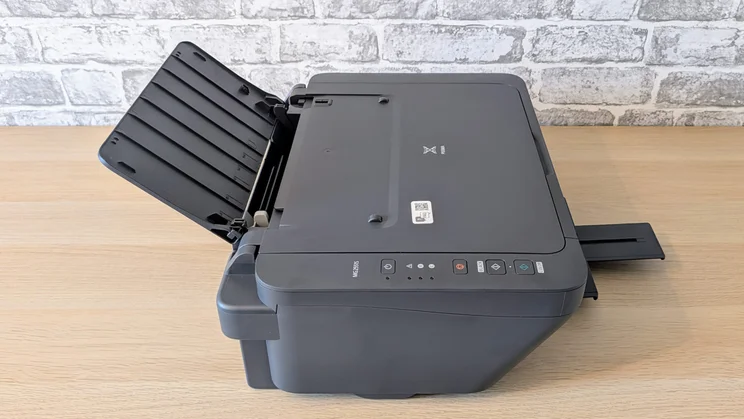 The Canon Pixma MG2551S pictured on a desk from the side