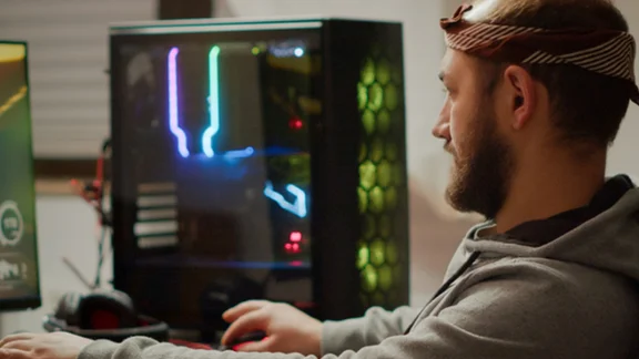 The best broadband for gamers man using a gaming computer