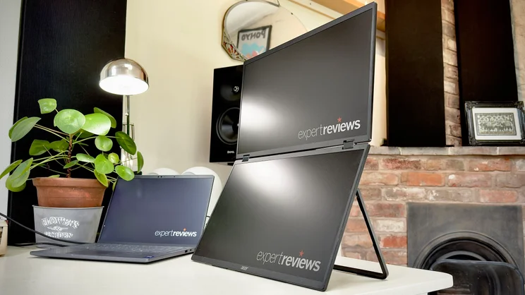 The Acer PD1933Q dual screen monitor sat on a desk next to a laptop and house plant